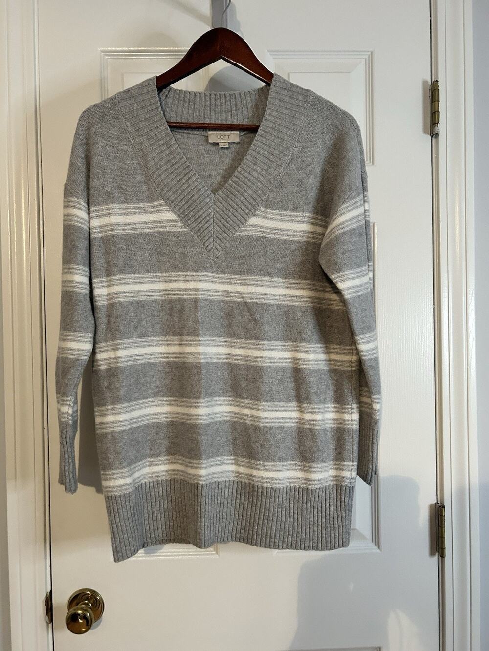 LOFT striped V-neck tunic sweater in women’s size Medium.